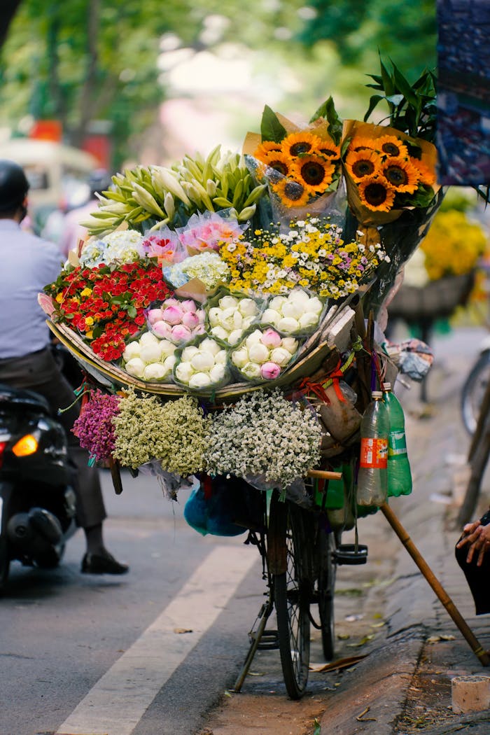 services-07 Vibrant bouquet on a bicycle captures Hanoi's street market scene.
